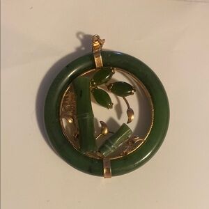 CHINESE JADE PENDANT. A Spinach Jade Ring Circles Jade Bamboo Gold tone leaves